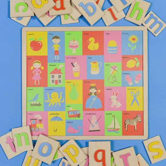 Video showing wooden alphabet toy.  Wooden letter pieces lift away to show images starting with the same letter.  